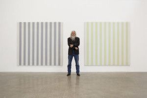 Artist Olivier Mosset between two striped paintings, Milan 2009