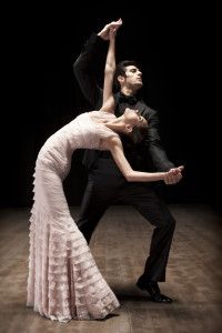 Couple dancing, woman arched back in an ivory gown, Sur la Terre inTown, 2011