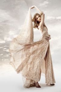 Model in an ivory lace gown, arms raised, Sur la Terre inTown 2012