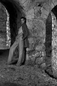 Model in an ancient stone arcade, black and white, Sur la Terre inTown, Greece 2012