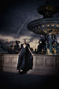 Model in black gown at the Place de la Concorde fountain, Paris 2012