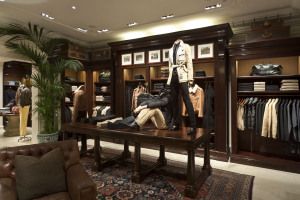 Ralph Lauren store with dark wood cabinetry and Persian rug, Milan