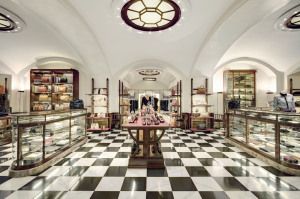 Prada store interior with display cases and chequered floor, Galleria Vittorio Emanuele II, Milan