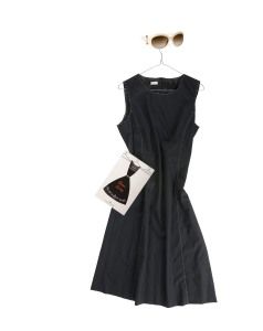 Black dress, sunglasses and card on a hanger, personal still life research