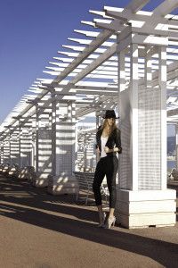 Model in hat under a white pergola by the sea, Nice, Germano Zama catalogue S/S 2012