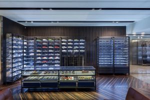 Wall of sneakers in glass cabinets, Prada Sport, Corso Venezia, Milan