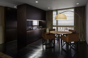 Dining area with arc floor lamp and round table, Armani/Casa residence, Century Spire, Manila