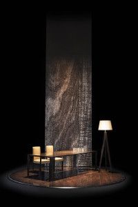 Armani/Casa table and lamp under a tall wood panel, Salone del Mobile 2014