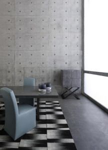 Armani/Casa dining chairs and patterned rug against concrete, advertising campaign 2014