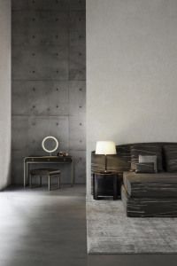 Armani/Casa bedroom with vanity table against concrete walls, advertising campaign 2014