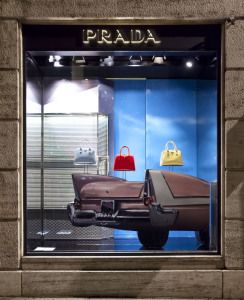 Prada shop window with a vintage car and handbags, via Montenapoleone, Milan