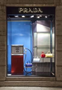 Prada shop window with a vintage fuel pump and handbags, via Montenapoleone, Milan
