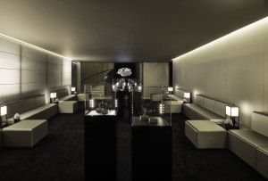 Lounge with white sofas inside the Emporio Armani stand, Baselworld 2014