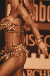 Close-up of a dancer's torso in a fringed costume