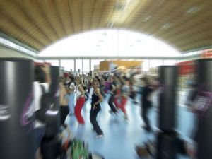Aerobics class at a fitness expo in Rimini, motion blur