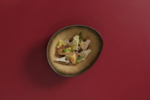 Warm Sicilian langoustine salad on a red background, Le Triptyque, Cheval Blanc Courchevel