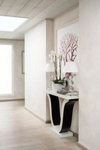 Entrance hall with console and orchids, Villa Flamands, Cheval Blanc St-Barth