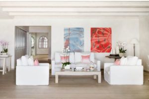 White living room with sofas and red artwork, Villa Flamands, Cheval Blanc St-Barth