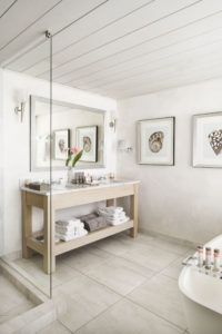 Bathroom with vanity and framed shells, Villa Flamands, Cheval Blanc St-Barth