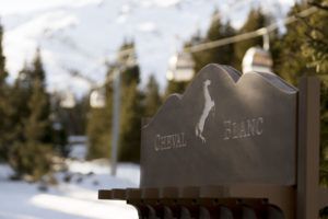 Cheval Blanc Courchevel sign in the snow, French Alps