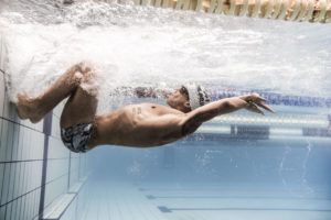 Male swimmer turning underwater, arena Water Instinct S/S 2018 catalogue