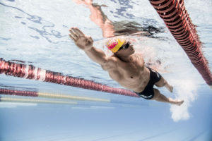 Male swimmer diving under the lane ropes, arena Water Instinct S/S 2018 catalogue